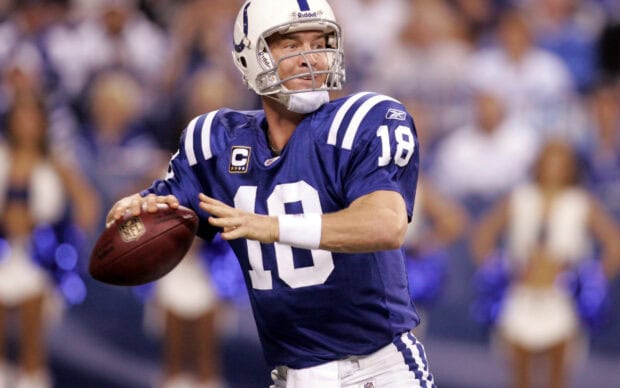 Indianapolis Colts player wearing number 18 preparing to throw the football during a game