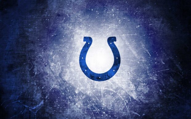 Blue Indianapolis Colts logo on a textured dark background with light center glow