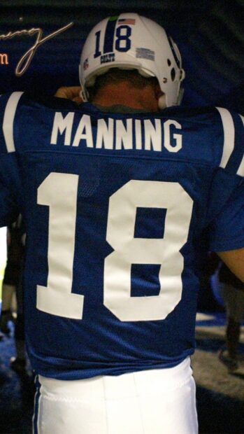 The back of a football player wearing a Manning jersey with the number 18 for Indianapolis Colts
