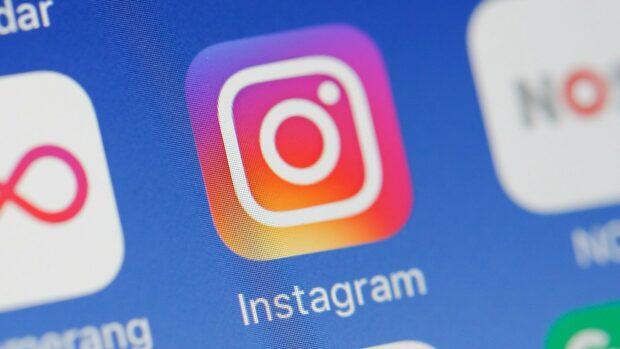 A close up view of the Instagram app icon on a digital screen showing vibrant colors, HD Desktop Wallpaper