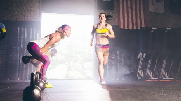 Two women focus on their Crossfit workout with kettlebells and running, HD Desktop Wallpaper
