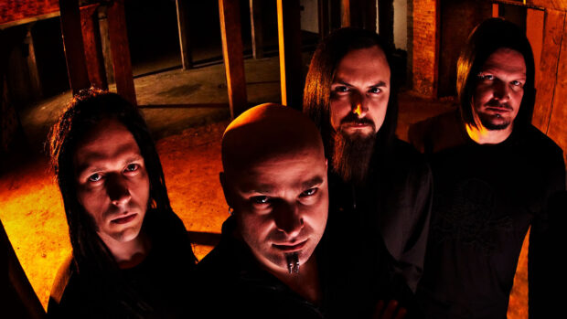 The Disturbed band members pose with intense expressions in a dimly lit room, HD Desktop Wallpaper