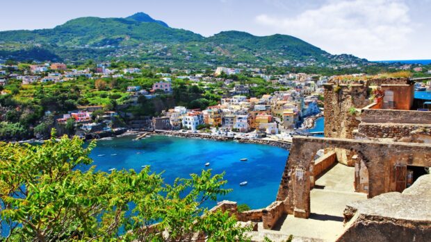 Scenic view of Ischia town and lush hills surrounding the vibrant coastline