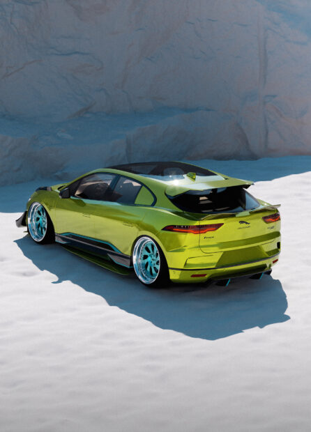 A green Jaguar I Pace electric car is parked on a snowy surface with rocky cliffs in the background, HD Mobile Wallpaper