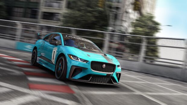 A blue Jaguar I Pace racing fast on an urban circuit with motion blur, 4K PC Wallpaper