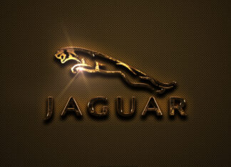 A shiny golden jaguar logo with a reflective texture on a dark patterned background