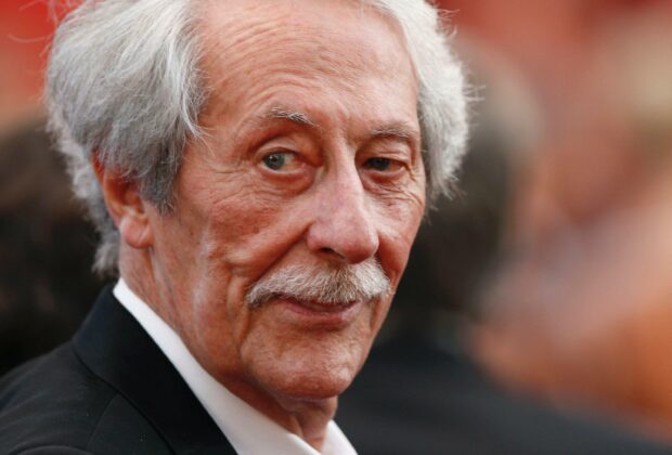 Jean Rochefort looks thoughtfully to the side in a formal setting, 2K Desktop Wallpaper
