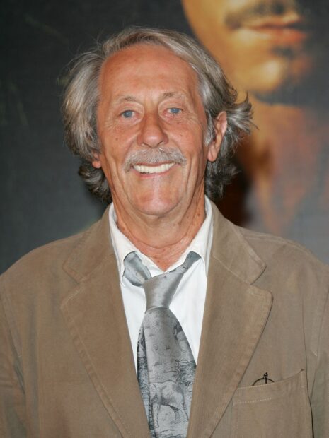 Jean Rochefort is smiling warmly wearing a brown jacket and a patterned tie, HD Desktop Wallpaper