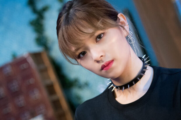 A close up portrait of Jeongyeon from Twice wearing earrings and a spiked choker, HD Desktop Wallpaper