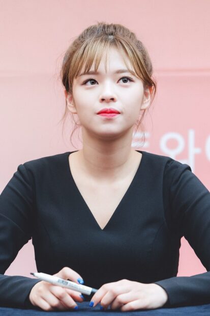 Jeongyeon Twice is captured looking thoughtful while wearing a black dress with a pink background, HD Phone Wallpaper