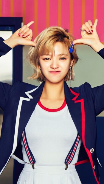 Jeongyeon Twice smiles playfully with hand gestures in a vibrant setting, HD Phone Wallpaper