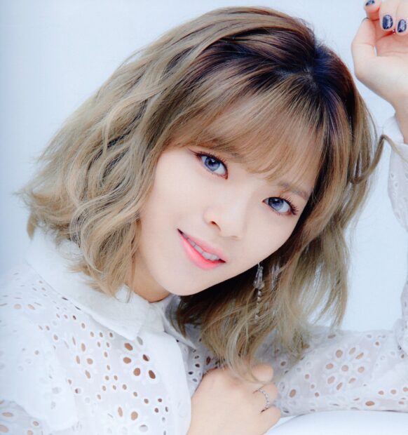 A close up of Jeongyeon Twice with short wavy hair smiling gently, HD Mobile Wallpaper