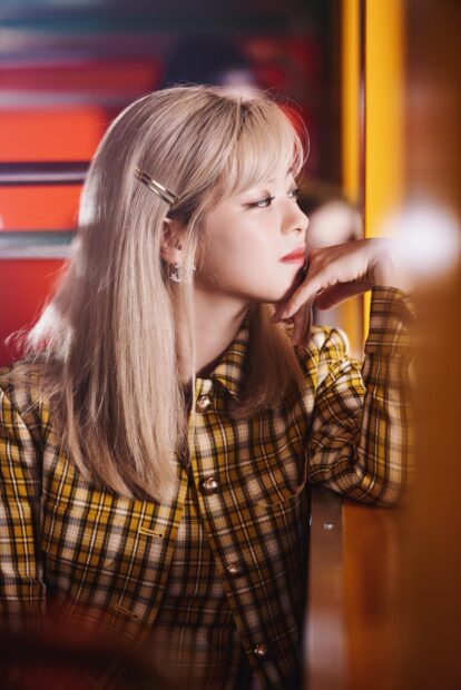 A side profile of Jeongyeon Twice in a yellow plaid outfit looking thoughtfully out of frame, HD Phone Wallpaper