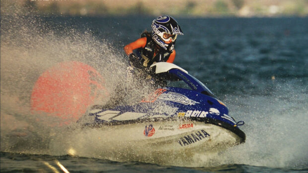 A person riding a jet ski at high speed creating water splashes, HD Desktop Wallpaper