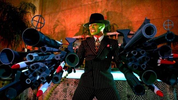 Jim Carrey as The Mask holds multiple guns in a dramatic scene, HD Desktop Wallpaper