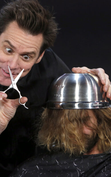 Jim Carrey is holding scissors near the hair of a person wearing a metal bowl as a hat, HD Phone Wallpaper