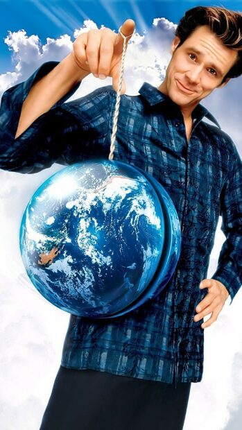 Jim Carrey holding a globe with clouds in the background and a playful expression, 2K Phone Wallpaper