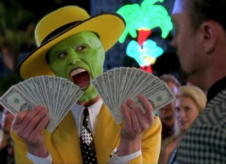 Jim Carrey holding fans of dollar bills with a shocked expression, HD Desktop Wallpaper