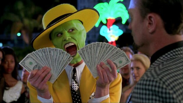Jim Carrey holding fans of dollar bills with a shocked expression, HD Desktop Wallpaper