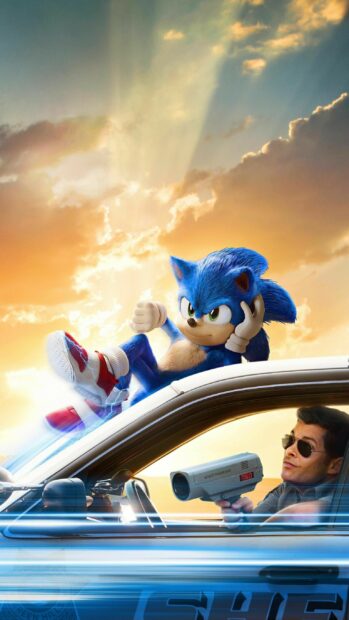 Jim Carrey watches Sonic speeding on a car roof at sunset, 2K Phone Wallpaper