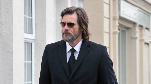 A man wearing sunglasses and a black suit walking outside, HD Desktop Wallpaper