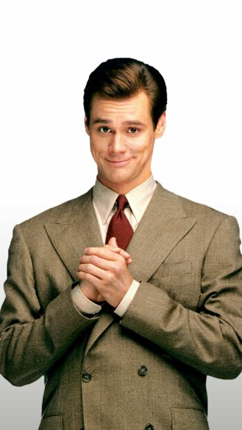 Jim Carrey is smiling confidently with hands clasped wearing a beige suit, 2K Phone Wallpaper