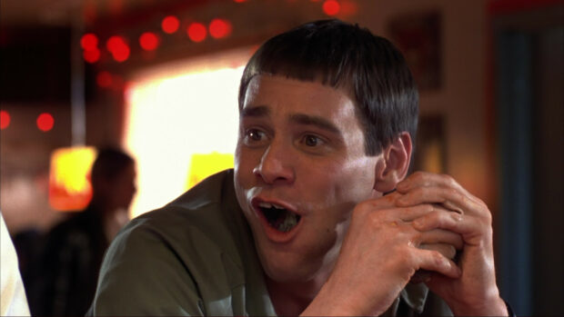 Jim Carrey making a funny face with hands clasped, HD Desktop Wallpaper