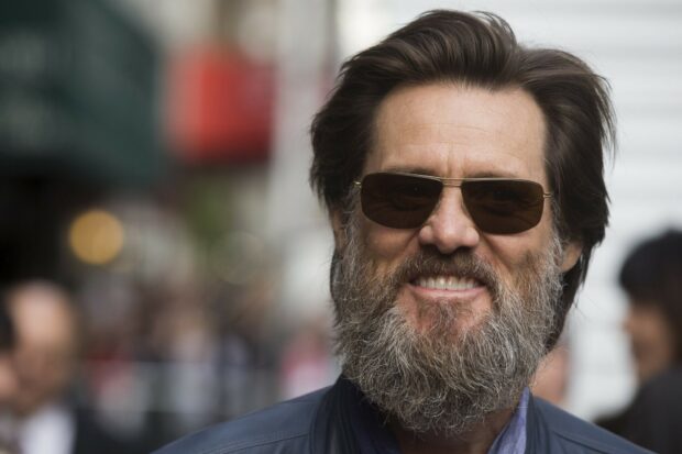 Jim Carrey with a full beard and sunglasses smiling outdoors, HD Desktop Wallpaper