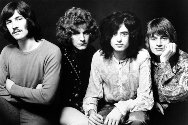 Jimmy Page band members sitting together in a black and white portrait with vintage style