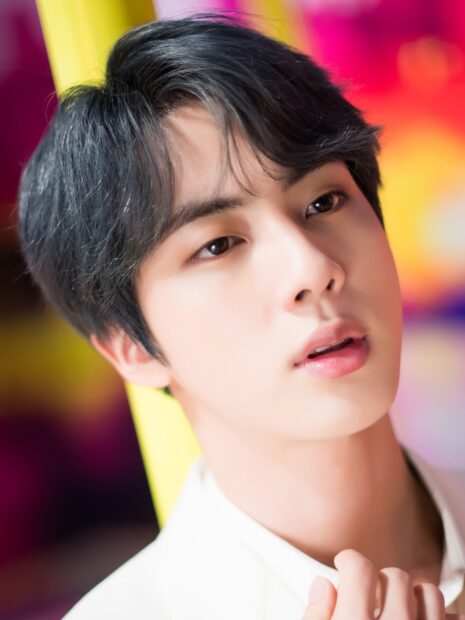 A close up portrait of Jin BTS showing his soft expression and dark hair, HD Mobile Wallpaper