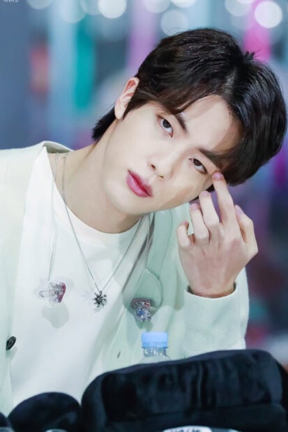 Jin BTS wallpapers show a close up of Jin's face with soft lighting, HD Mobile Wallpaper