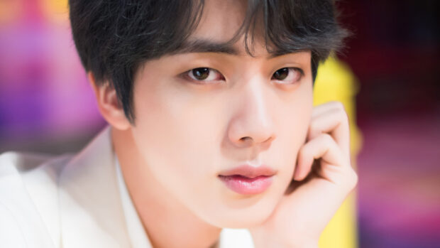 A close up portrait of Jin from BTS showing his thoughtful expression, 4K Mobile Wallpaper