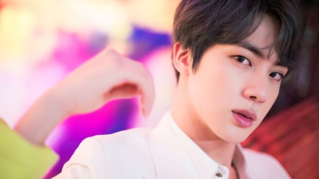 Jin BTS wallpapers show a close up portrait with a colorful background, 2K Desktop Wallpaper