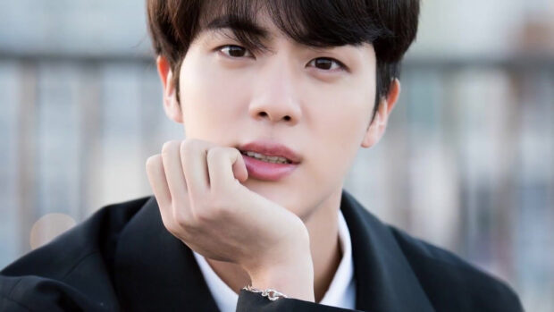 A close up portrait of Jin BTS showing his calm expression and neat hairstyle, HD Desktop Wallpaper