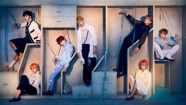 The Jin BTS Wallpapers group wears unique outfits in an artistic setup, 4K Desktop Wallpaper