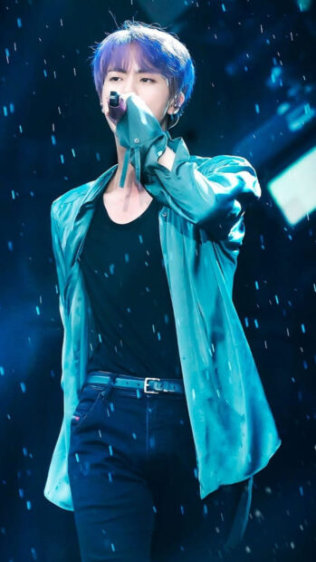 Jin BTS is singing passionately during a live concert under blue lighting, HD Phone Wallpaper