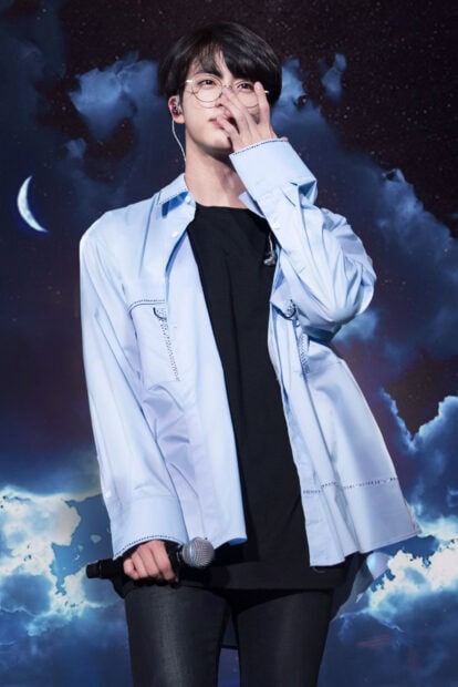 Jin BTS is singing on stage with a moonlit cloudy background, HD Desktop Wallpaper