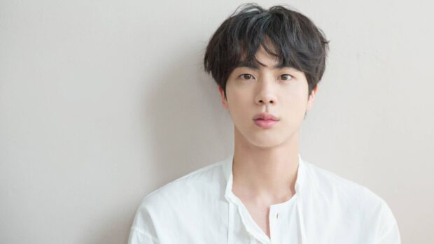 Jin Bts wallpapers shows a close up of Jin wearing a white shirt against a plain background, 4K Desktop Wallpaper