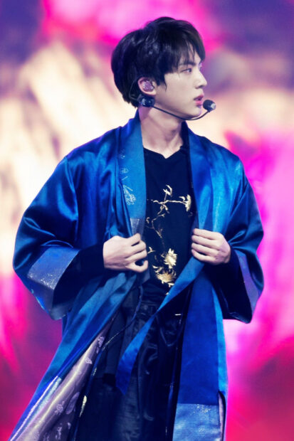 Jin Bts is performing on stage wearing a blue robe and holding it with both hands, HD Desktop Wallpaper