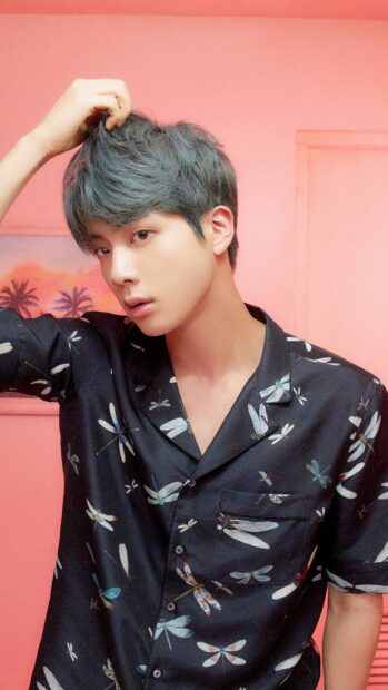 Jin Bts Wallpapers featuring a close up portrait of Jin with a floral shirt against a pink wall, 4K Mobile Wallpaper