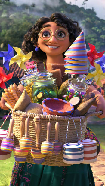 A happy girl with glasses carries a basket filled with vibrant toys and jars in a lush outdoor setting with Encanto wallpapers, 4K Phone Wallpaper