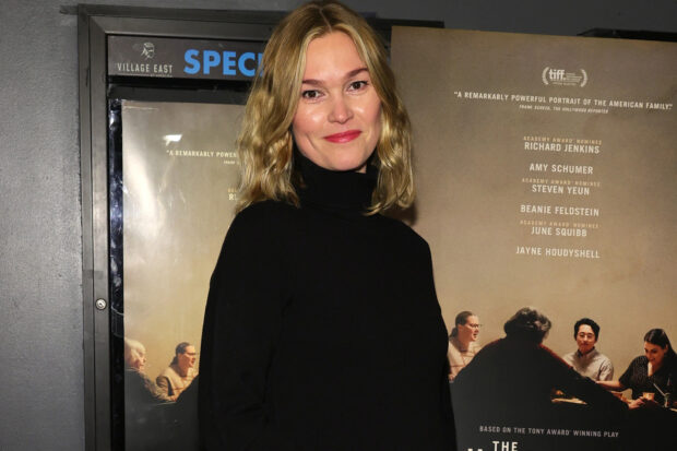 Julia Stiles wallpapers featuring a woman smiling in front of a movie poster, HD Desktop Wallpaper