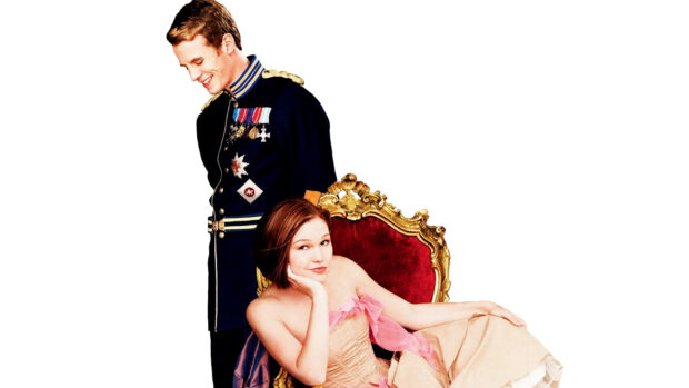 Julia Stiles sits on an ornate chair while a man in a royal uniform stands behind her, HD Desktop Wallpaper
