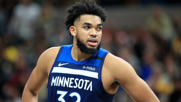 Karl Anthony Towns focused during basketball game with Minnesota jersey
