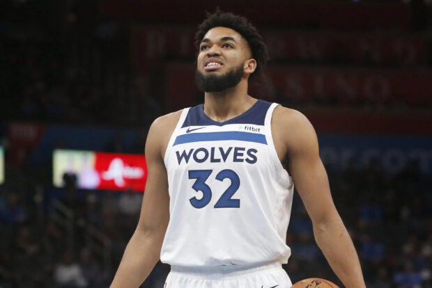Karl Anthony Towns in a Wolves jersey with number 32 during a basketball game