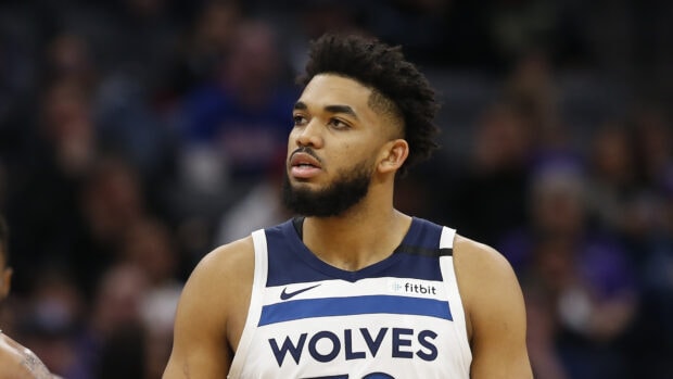 Karl Anthony Towns in a Wolves basketball jersey during a game on court