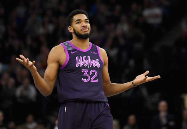 Karl Anthony Towns wearing a Wolves jersey with number 32 in an NBA game