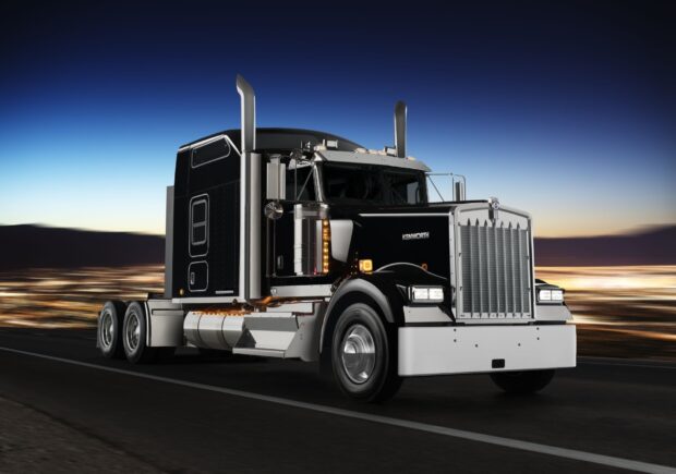 A Kenworth truck is driving on a highway with a clear evening sky in the background, HD Desktop Wallpaper