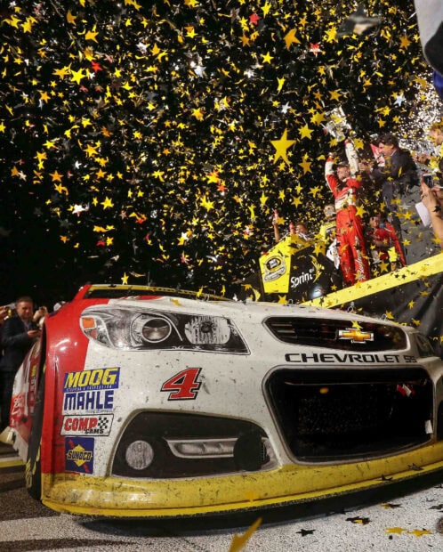 Kevin Harvick is celebrating his NASCAR win with confetti around his race car, HD Desktop Wallpaper