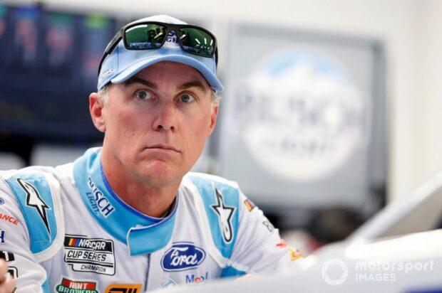 Kevin Harvick wearing a racing suit and cap during a motorsport event, HD Desktop Wallpaper